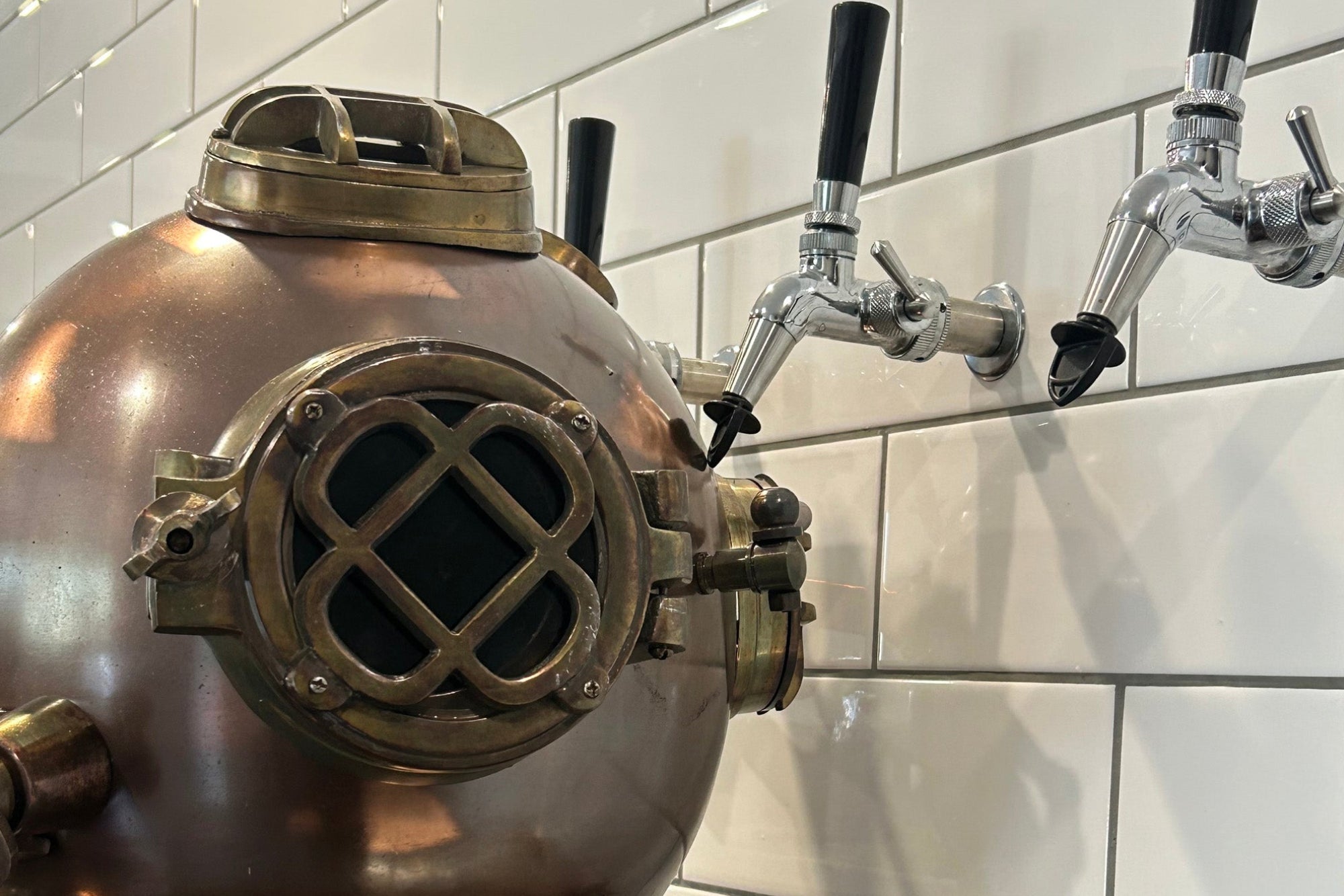 Sunlight filtering through the Two Fathoms brewery tanks